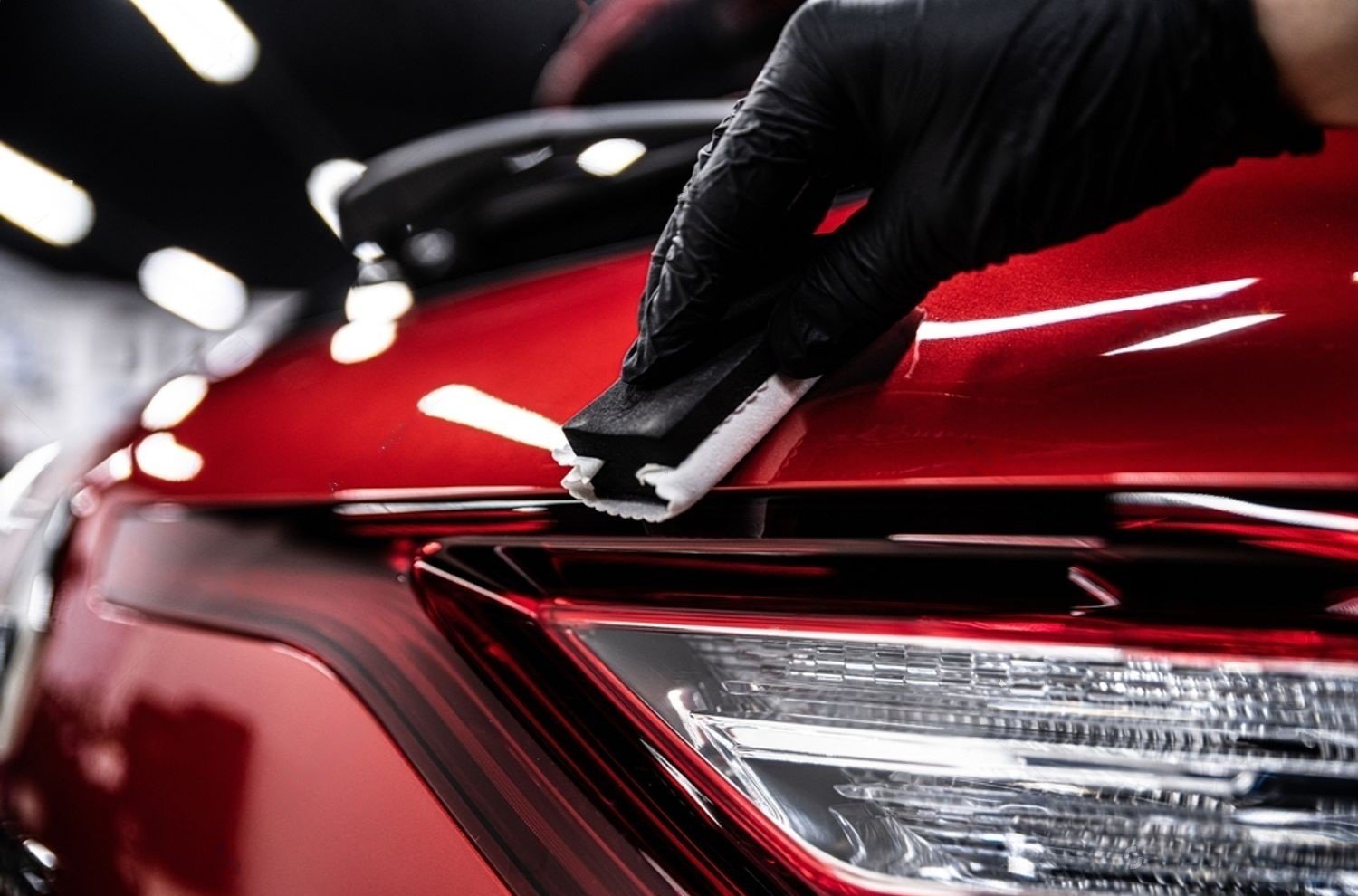 stock-photo-car-detailing-or-car-wash-worked-applying-ceramic-coating-on-red-car-body-2434366169-transformed